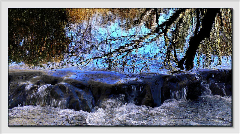 Waterfall with tree reflections
