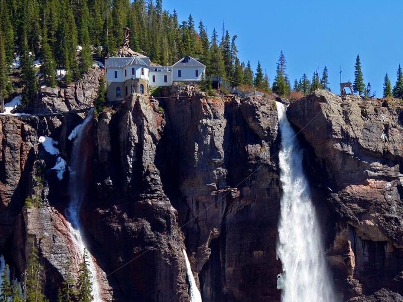Waterfalls and cliffside buildings