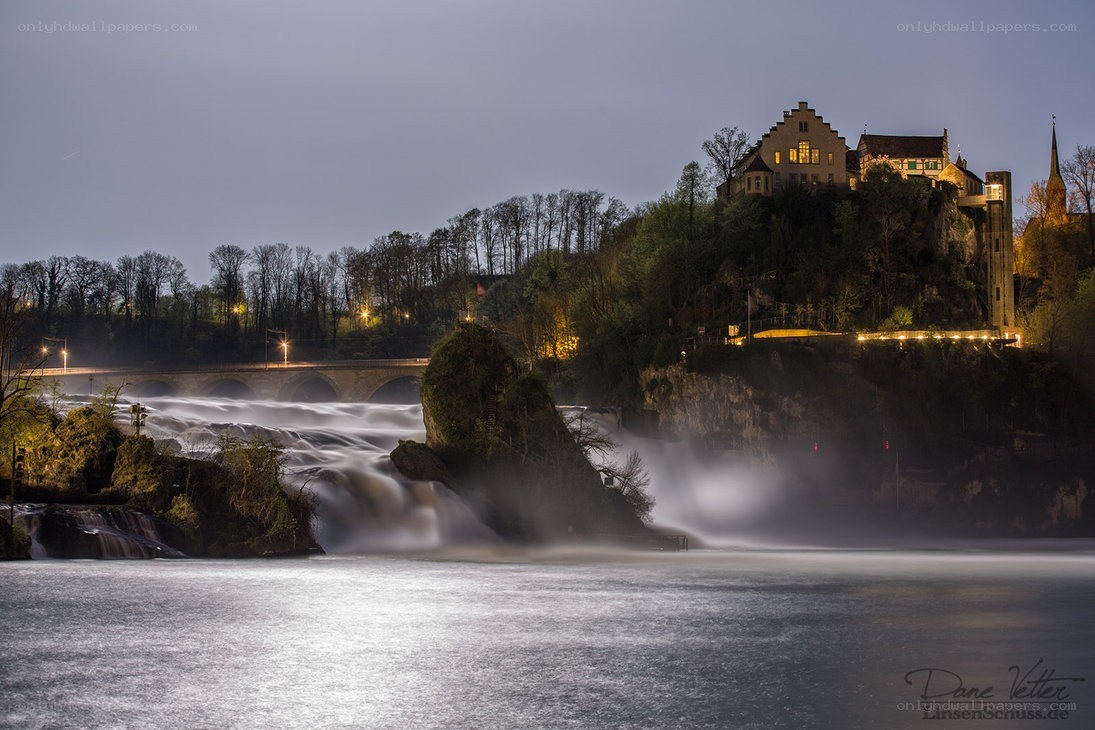 Waterfalls at dusk with castle