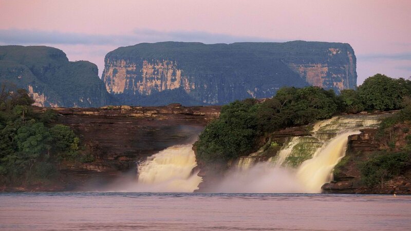 Waterfalls at dusk with cliffs