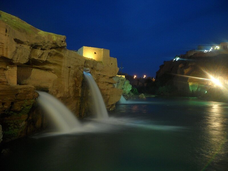 Waterfalls at night in a canyon