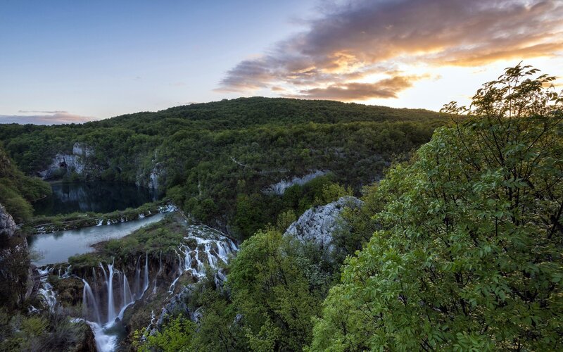 Waterfalls at sunset in a forest