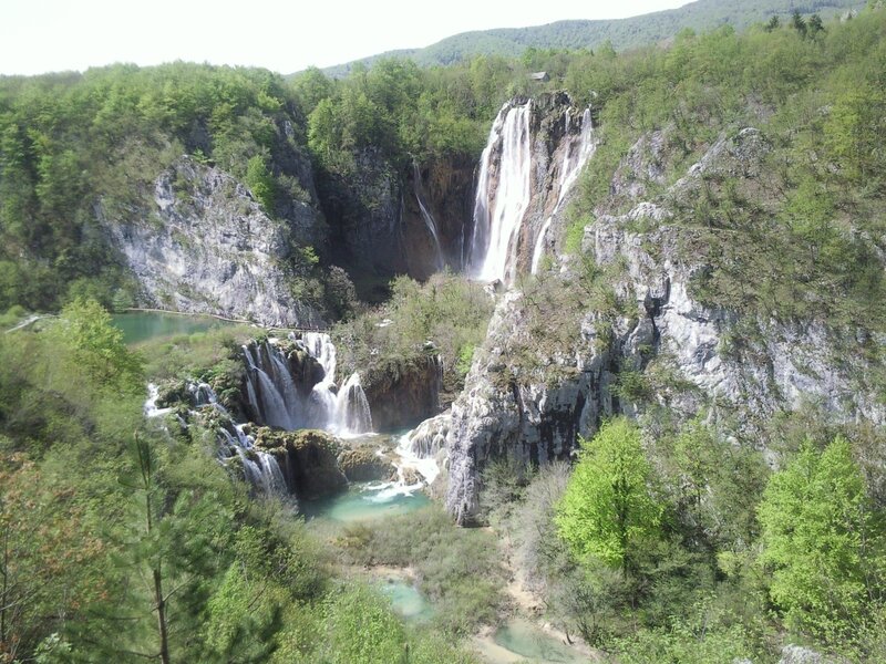 Waterfalls in a forested canyon