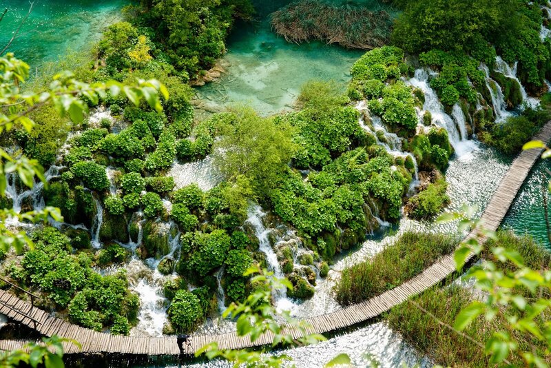 Waterfalls in a lush green landscape