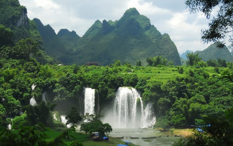 Waterfalls in a lush green valley