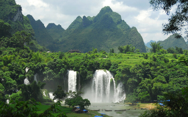Waterfalls in a lush mountain valley