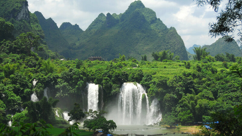 Waterfalls in a lush mountain valley