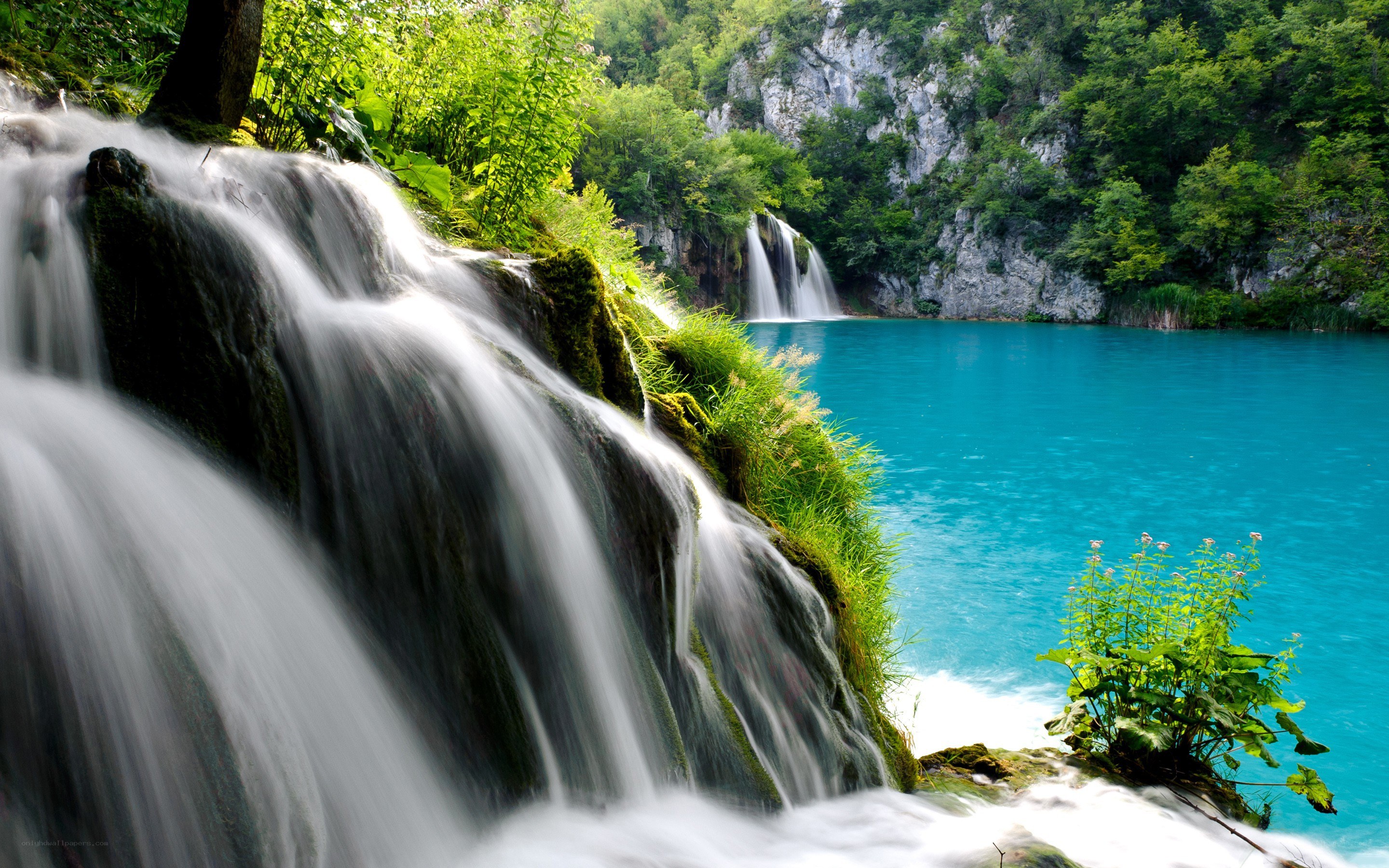 Waterfalls in a turquoise lake