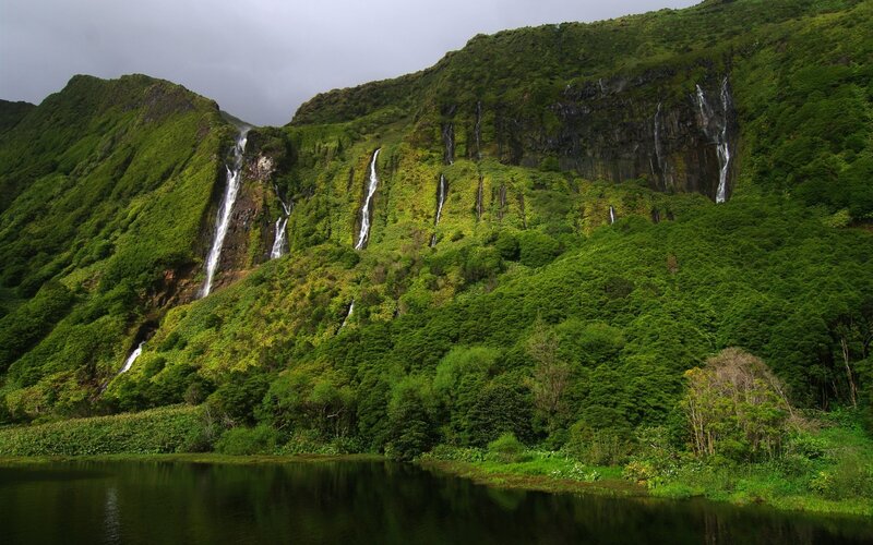 Waterfalls in lush green mountains