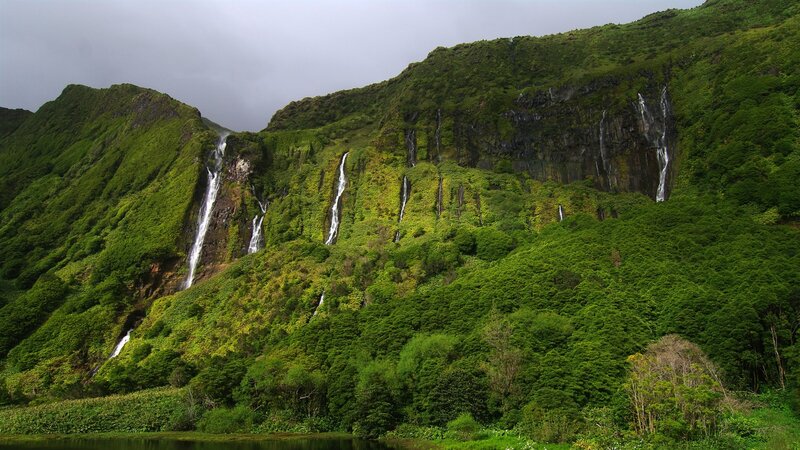 Waterfalls on a lush green hillside