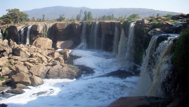 Waterfalls over Rocks — Brown