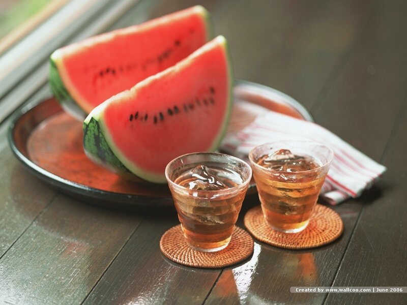 Watermelon and drinks on table