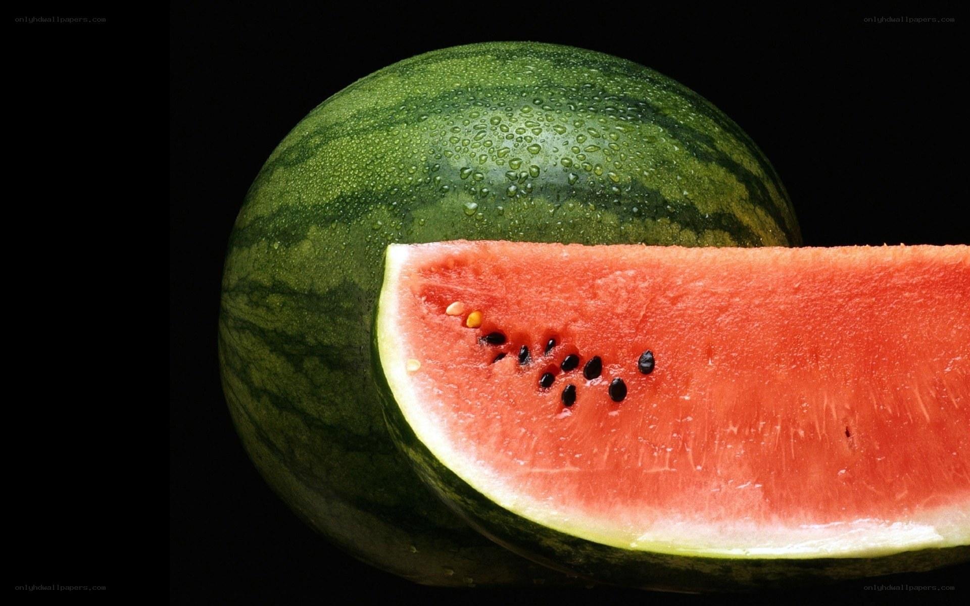 Watermelon slice on black background