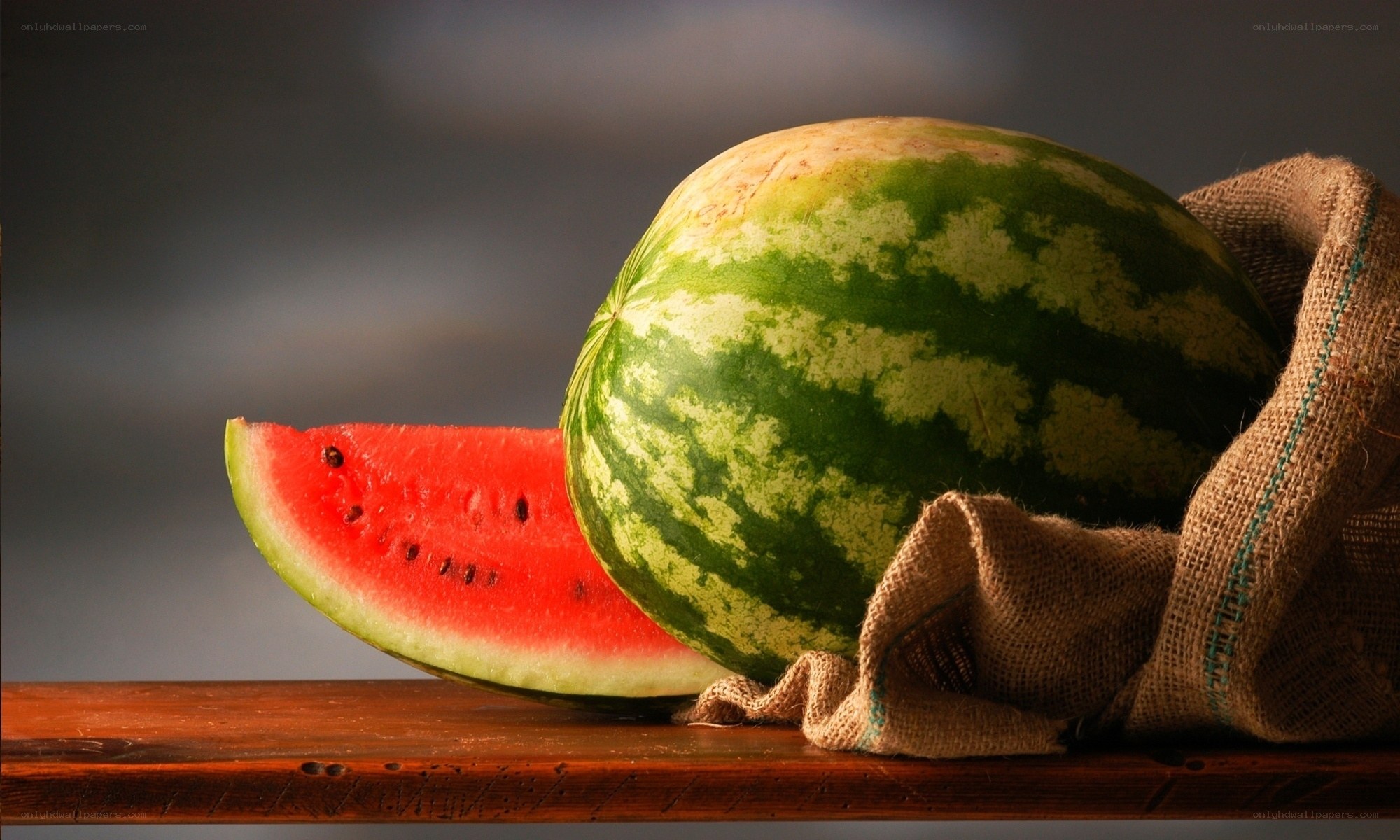 Watermelon slice on wooden table