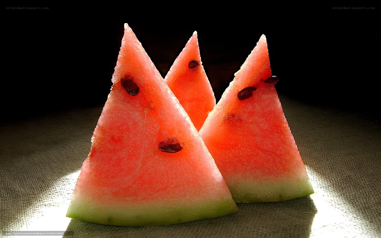 Watermelon slices on dark background