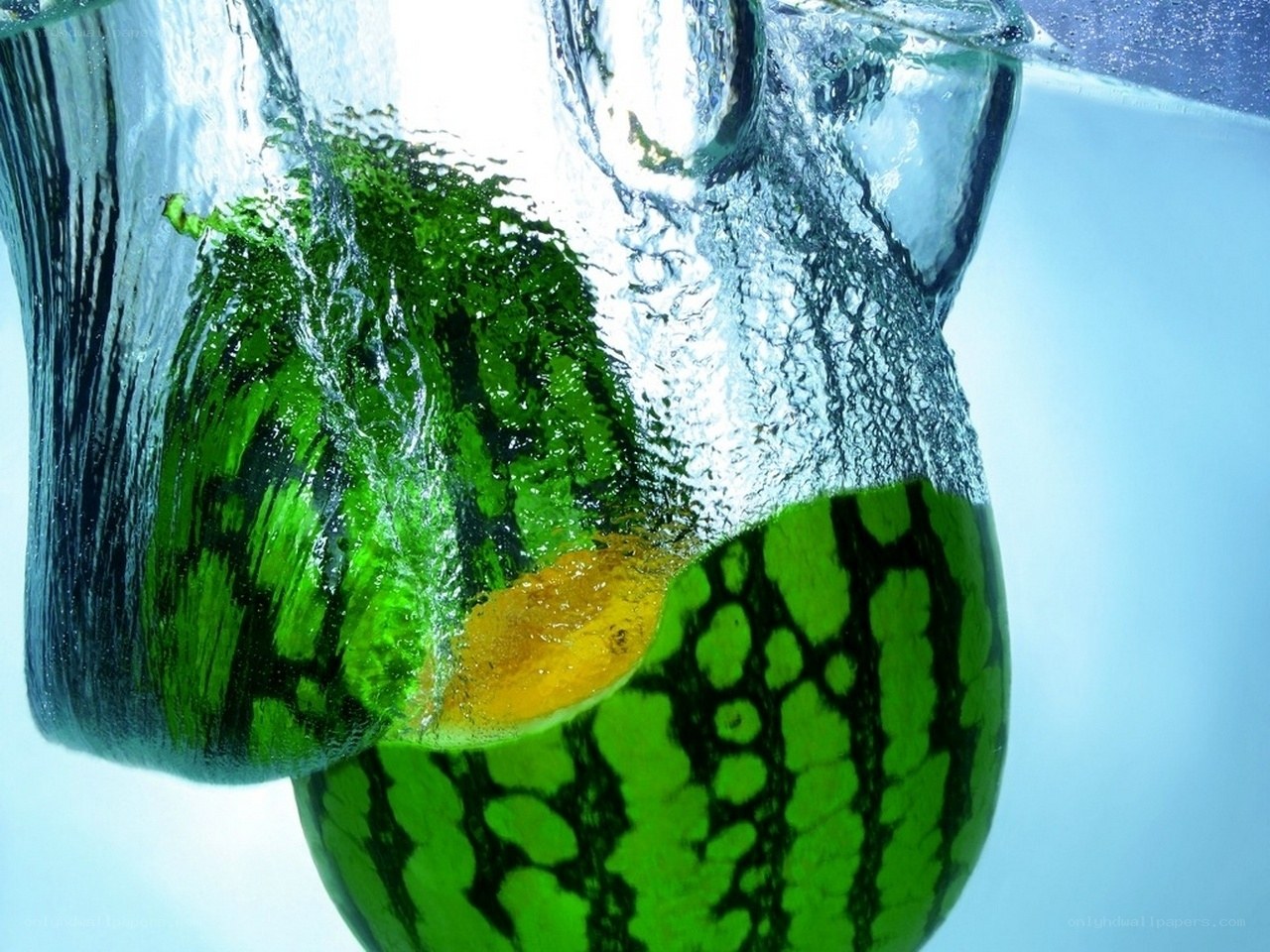 Watermelon splashing in water