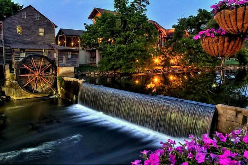 Watermill at dusk with waterfall