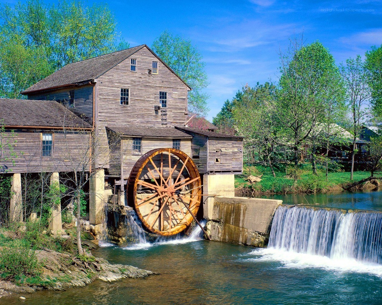 Watermill by a river