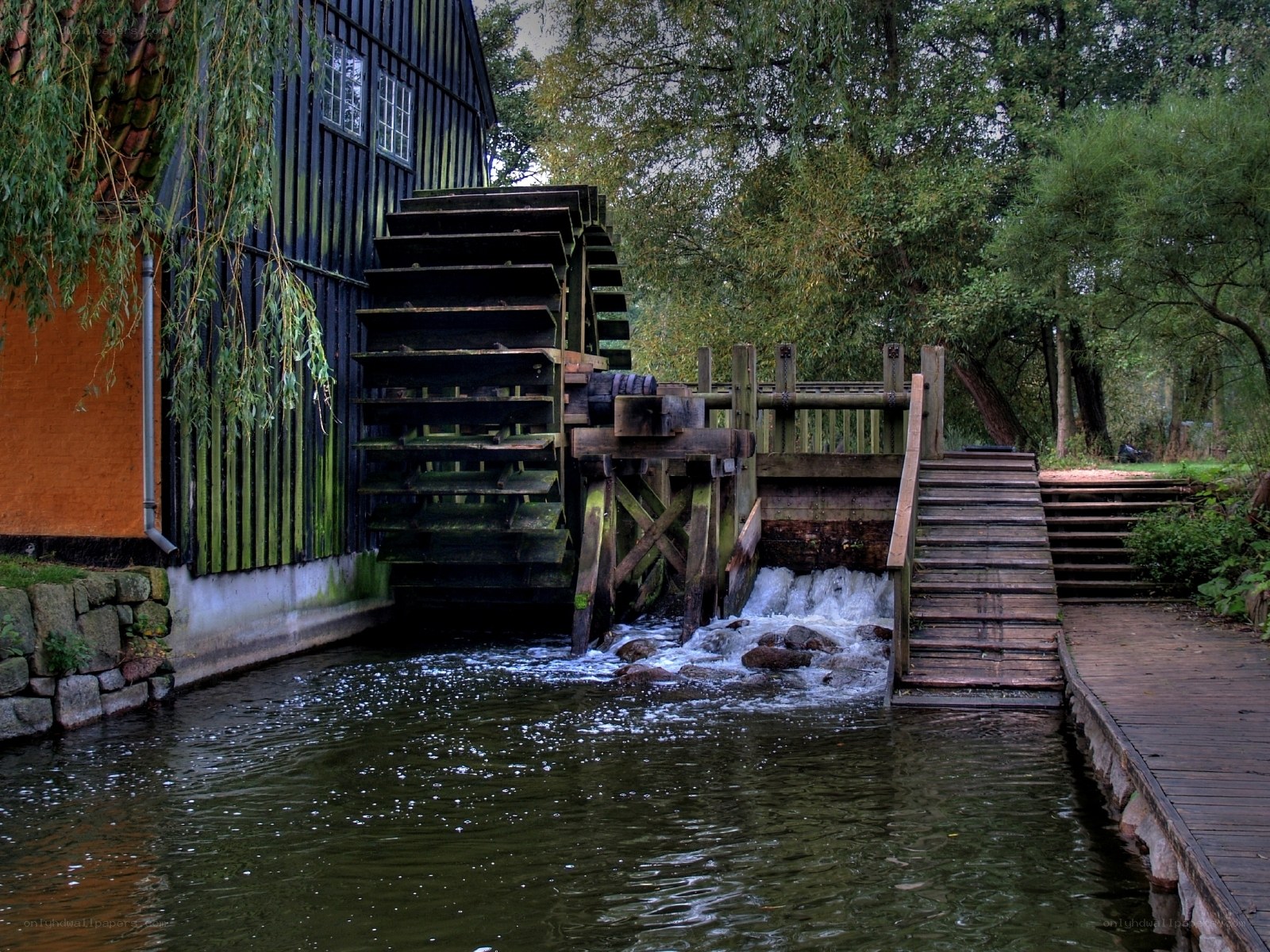 Watermill by a river