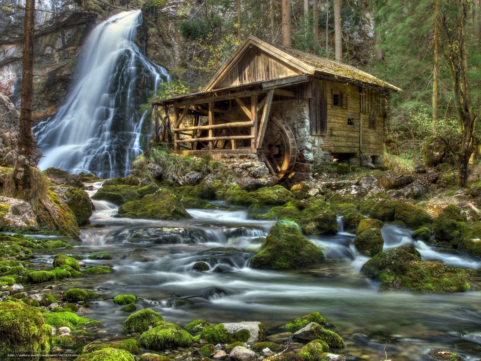 Watermill by a waterfall