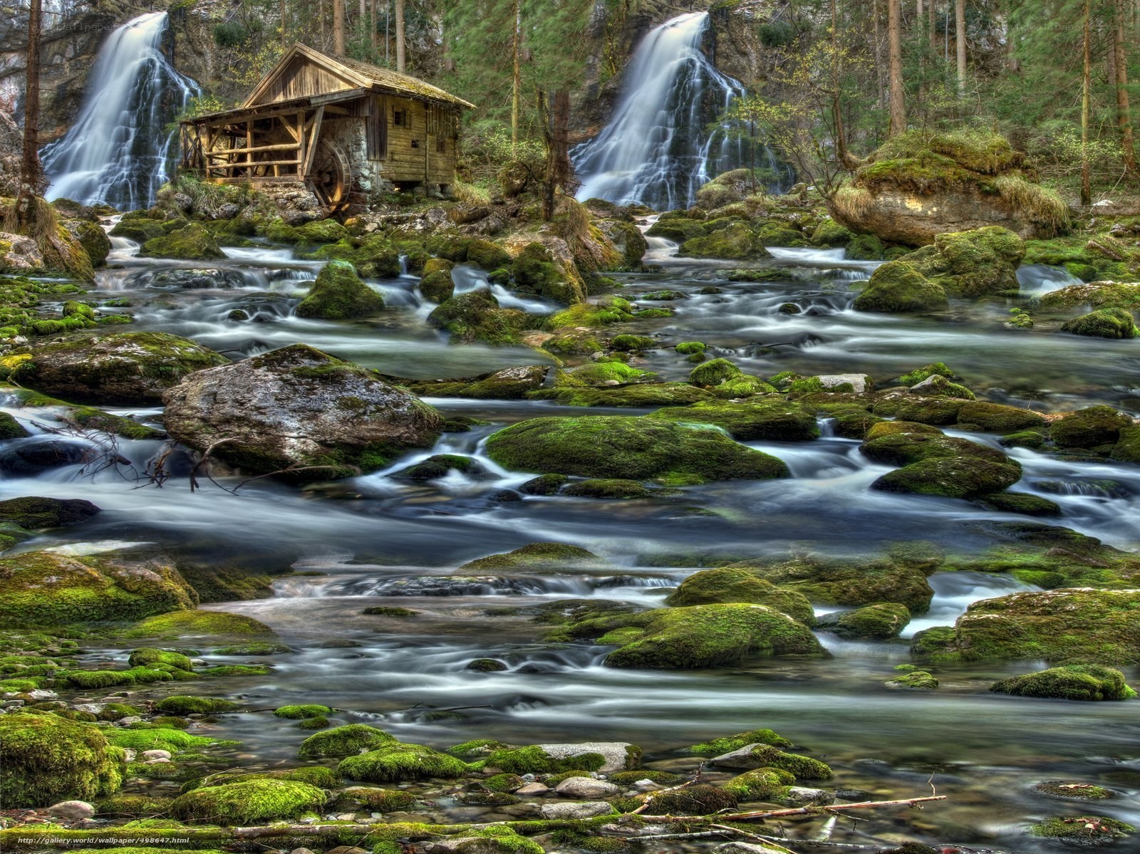 Watermill by a waterfall