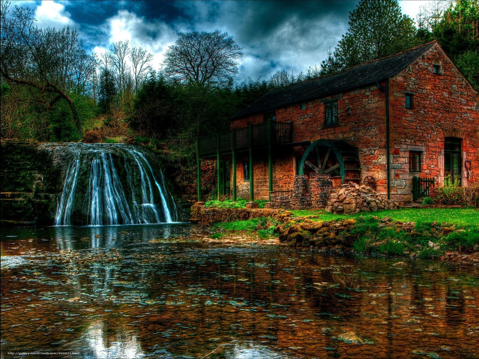 Watermill by a waterfall