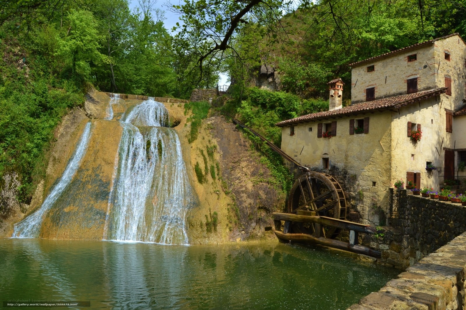 Watermill by a waterfall