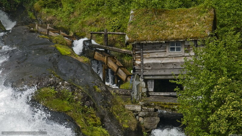 Watermill by a waterfall