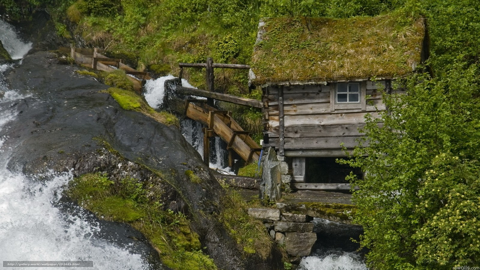 Watermill by a waterfall