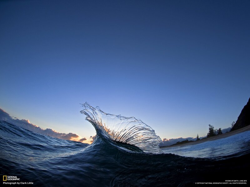 Wave at sunset on a beach