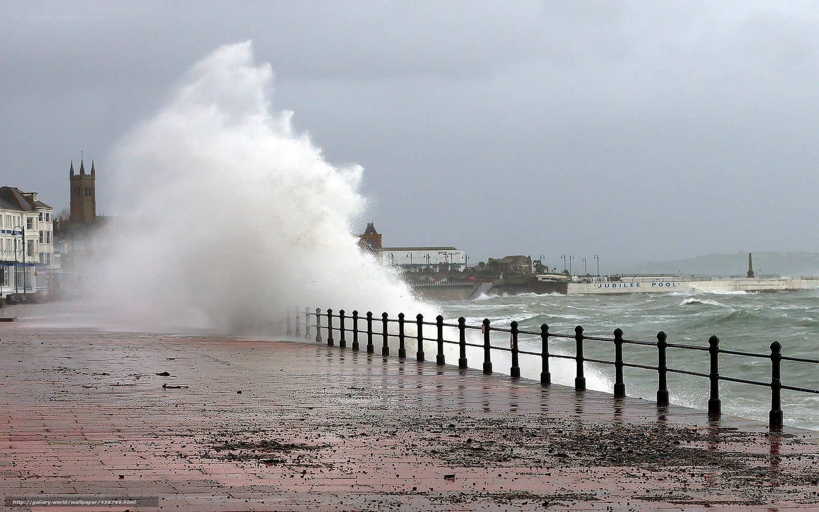 Wave crashes on sea wall