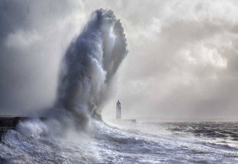 Wave Crashing on Lighthouse — Gray, Dramatic, Photograph