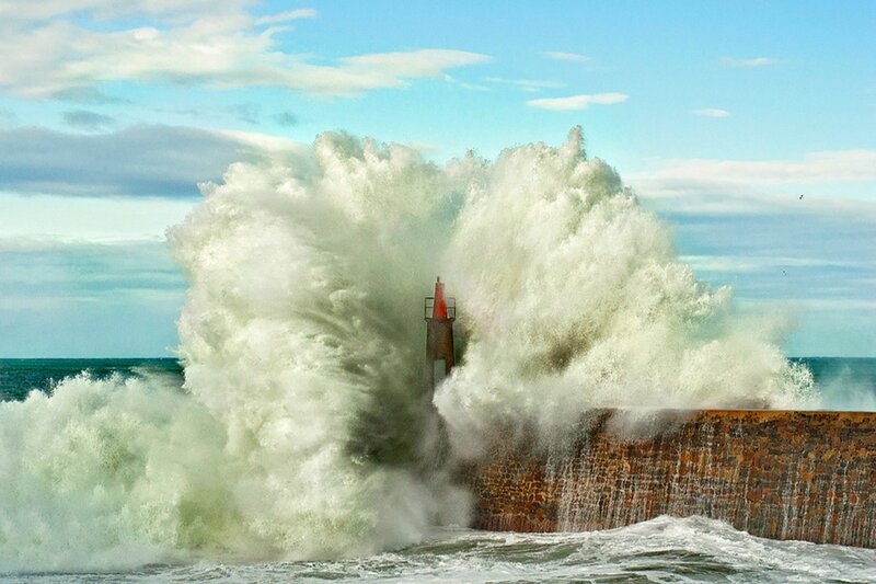 Wave Crashing on Lighthouse