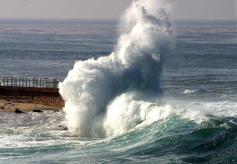 Wave Crashing on Pier — Blue, Dramatic, Afternoon