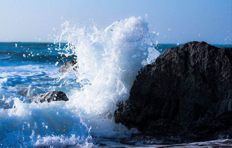 Wave Crashing on Rocks — White