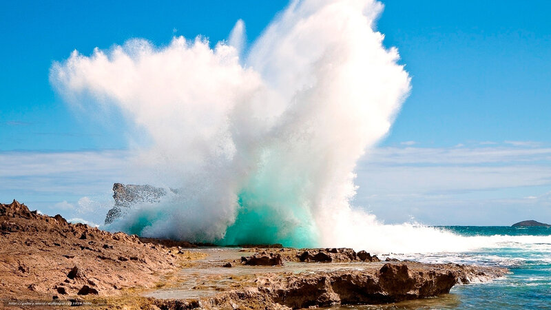 Wave crashing on rocky shore
