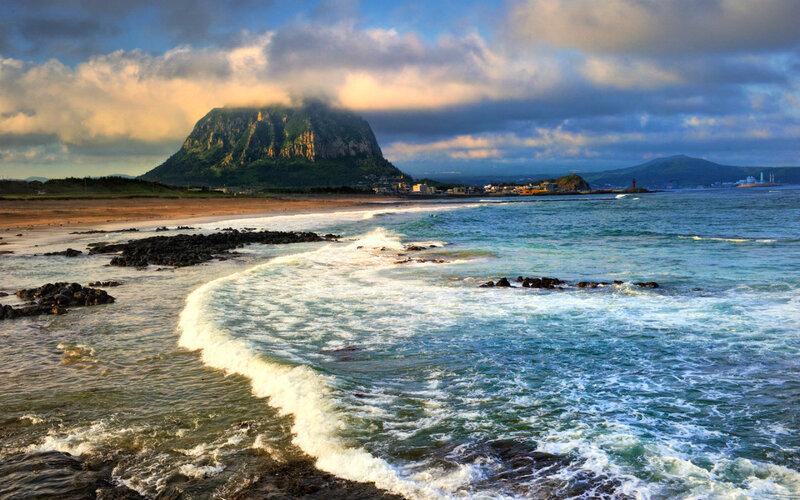 Wave Crashing on Rocky Shore — Blue
