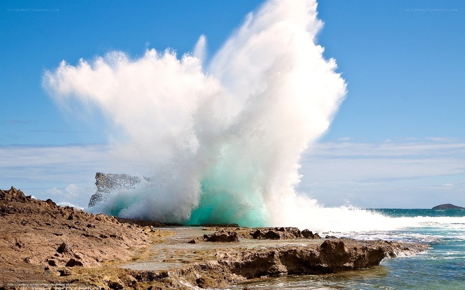 Wave crashing on rocky shore