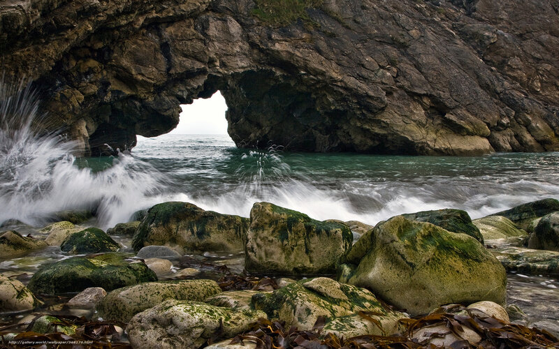 Wave Crashing Through Rock Arch — Green