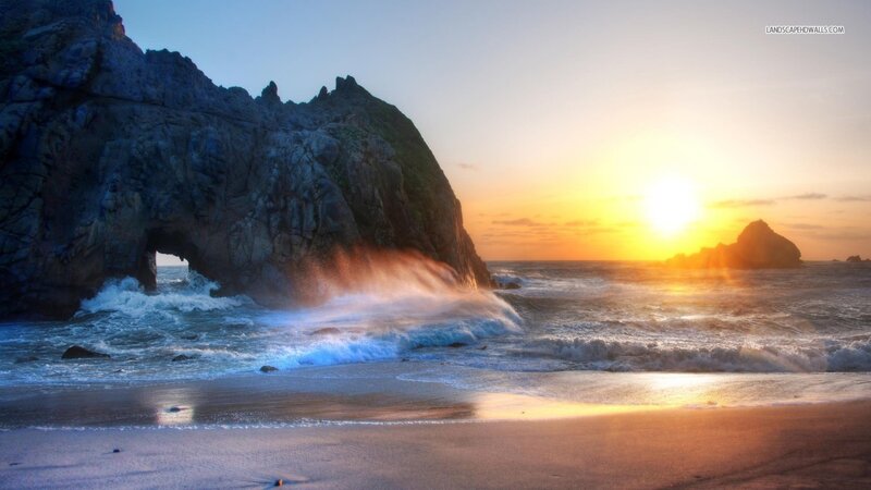 Wave Crashing Through Rock Arch — Orange
