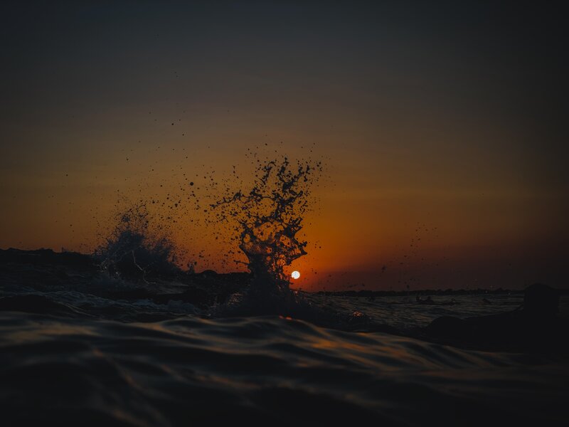 Wave Splashing at Sunset — Orange