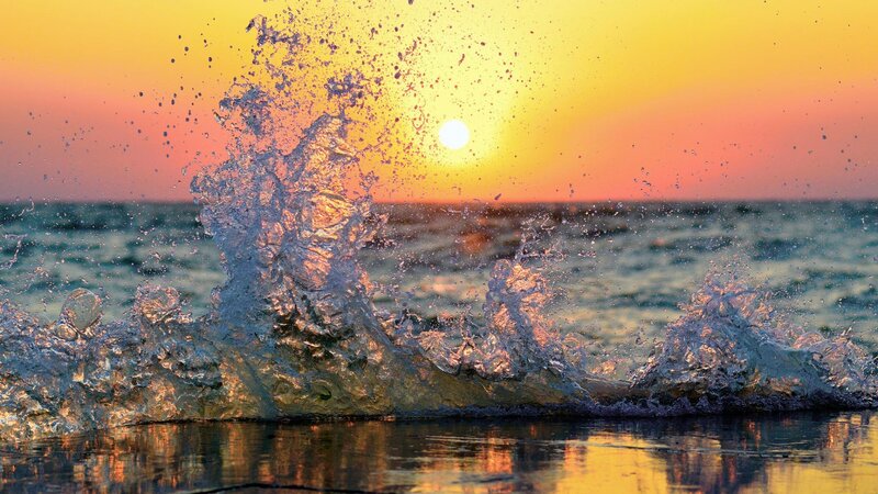 Wave Splashing at Sunset