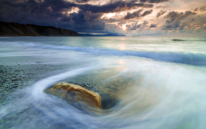 Wave Swirling Around Rock