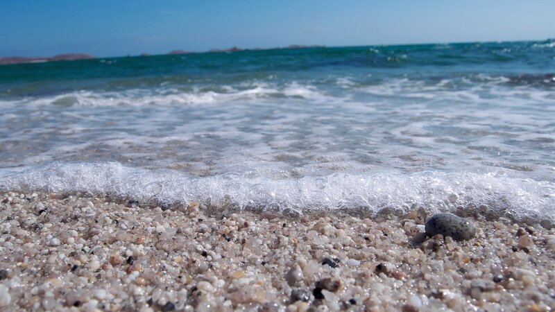 Wave washing over pebbles