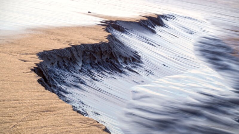 Wave Washing over Sand
