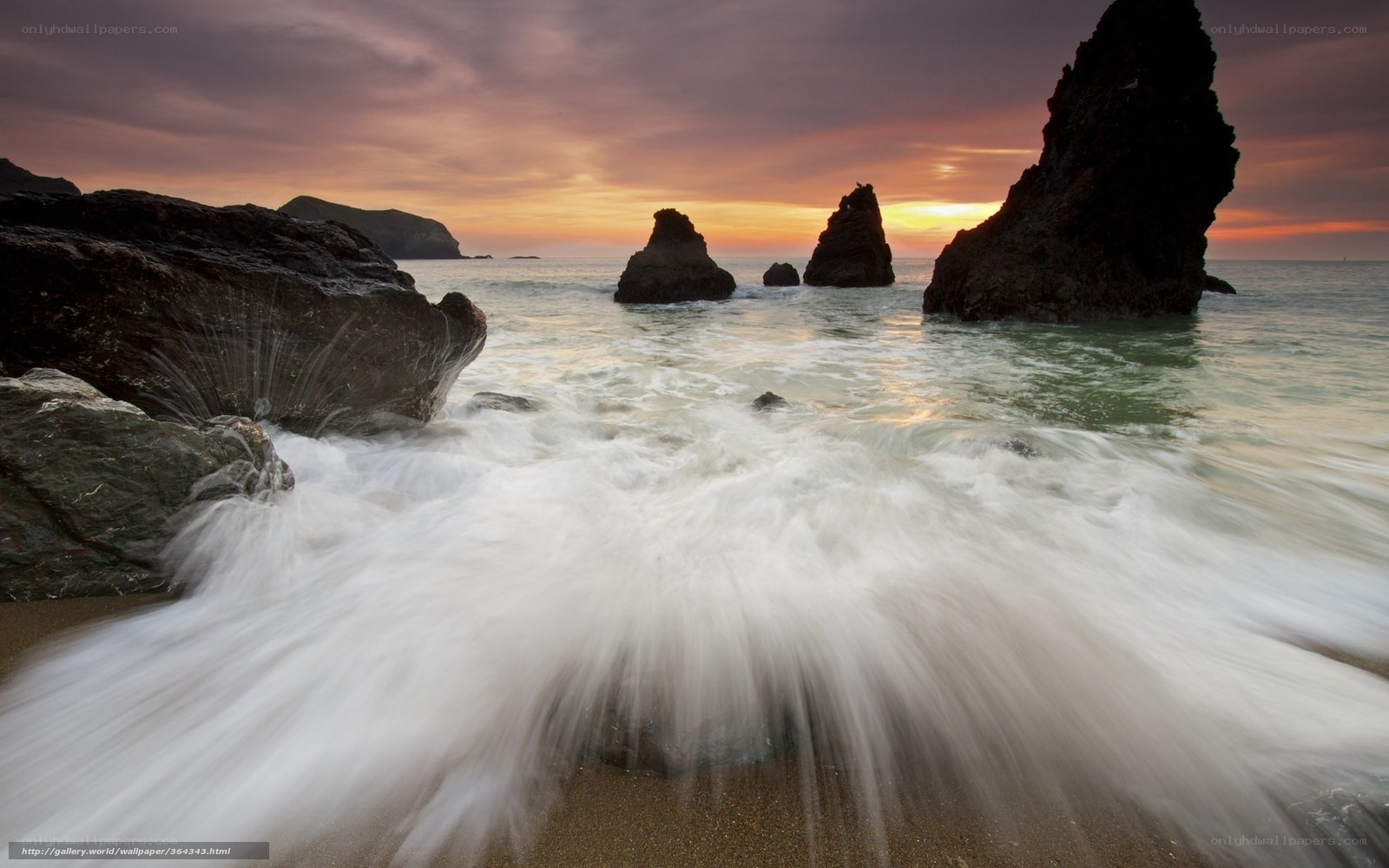 Waves at Sunset on a Rocky Shore