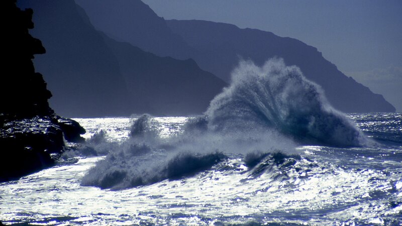 Waves crashing against rocky coast