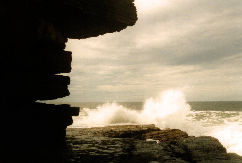 Waves crashing against rocky shore