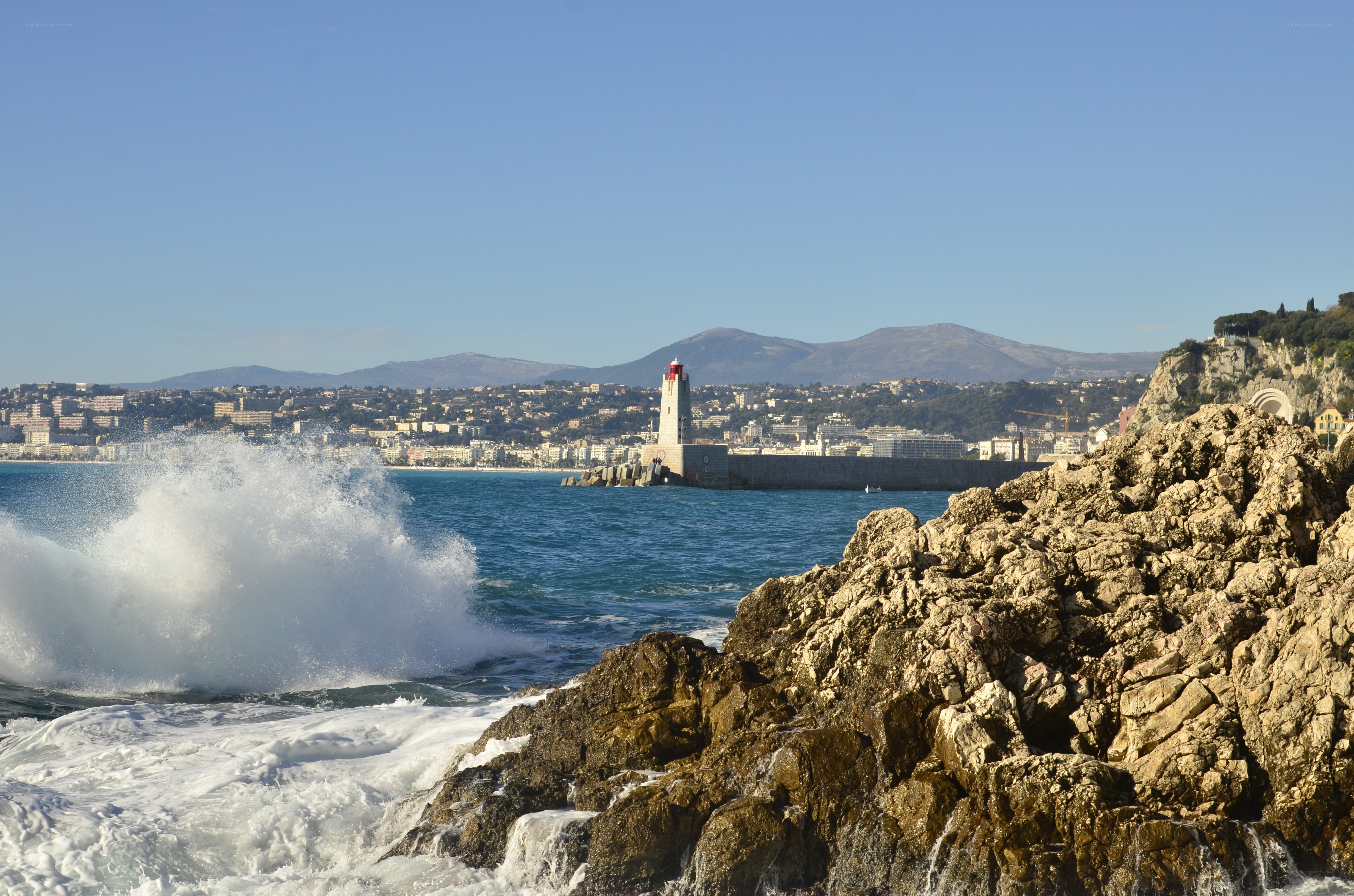 Waves crashing at a coastal city