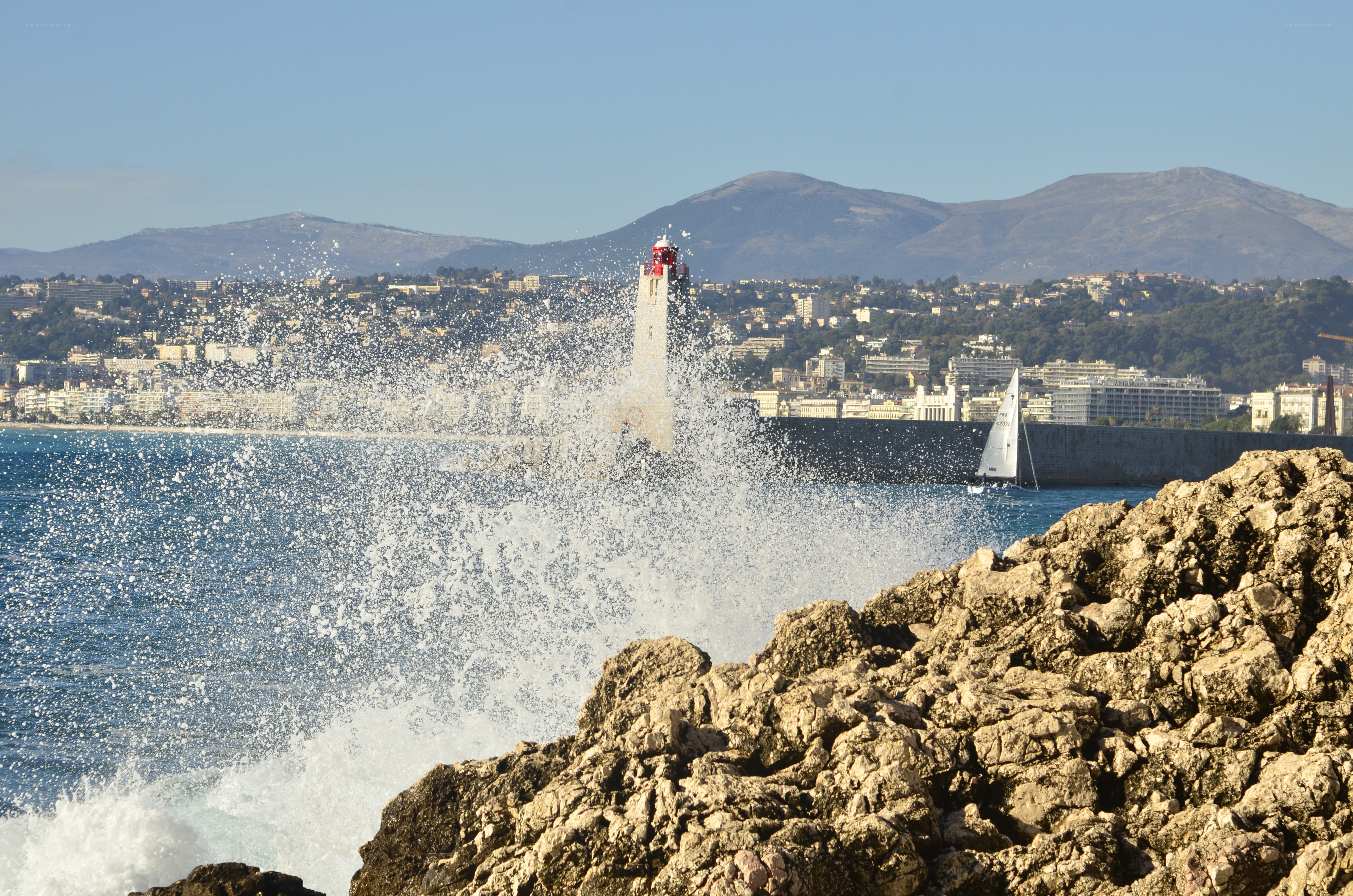 Waves crashing at a lighthouse